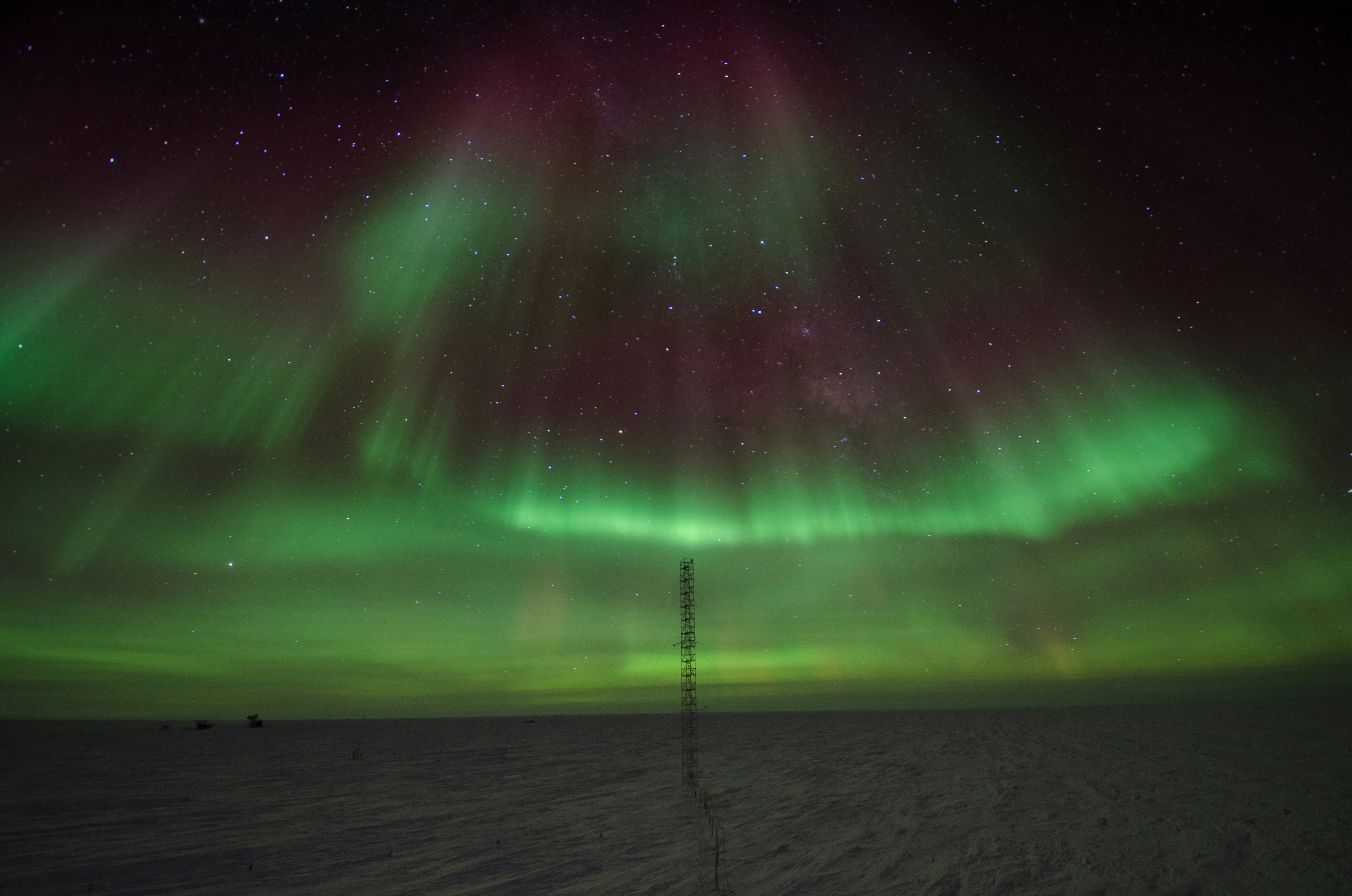 green and pink light in the sky